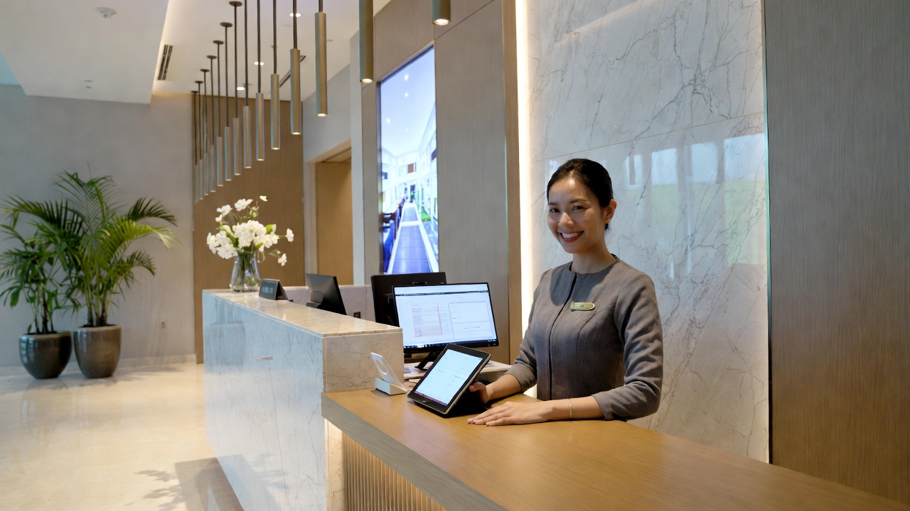 Modern hotel reception with digital management system